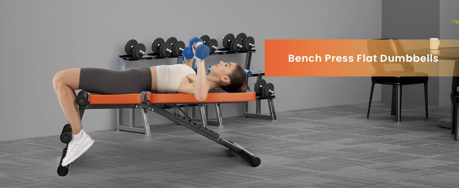 Person using a flat bench with dumbbells in a home gym setting