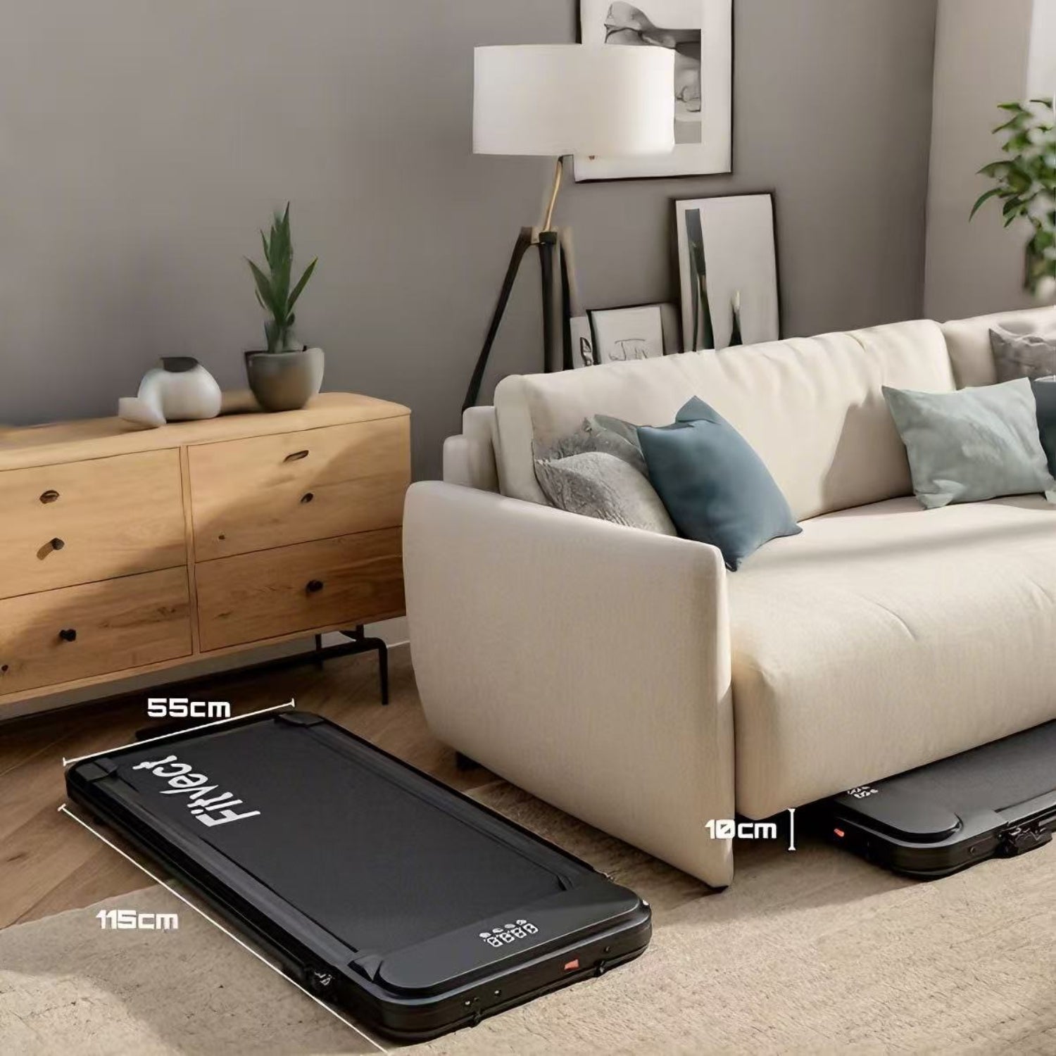 Black suitcase on a wooden floor with a beige sofa and wooden cabinet in the background.