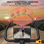 Bike handlebar with monitor displaying a cyclist on a road, against a sunset background.